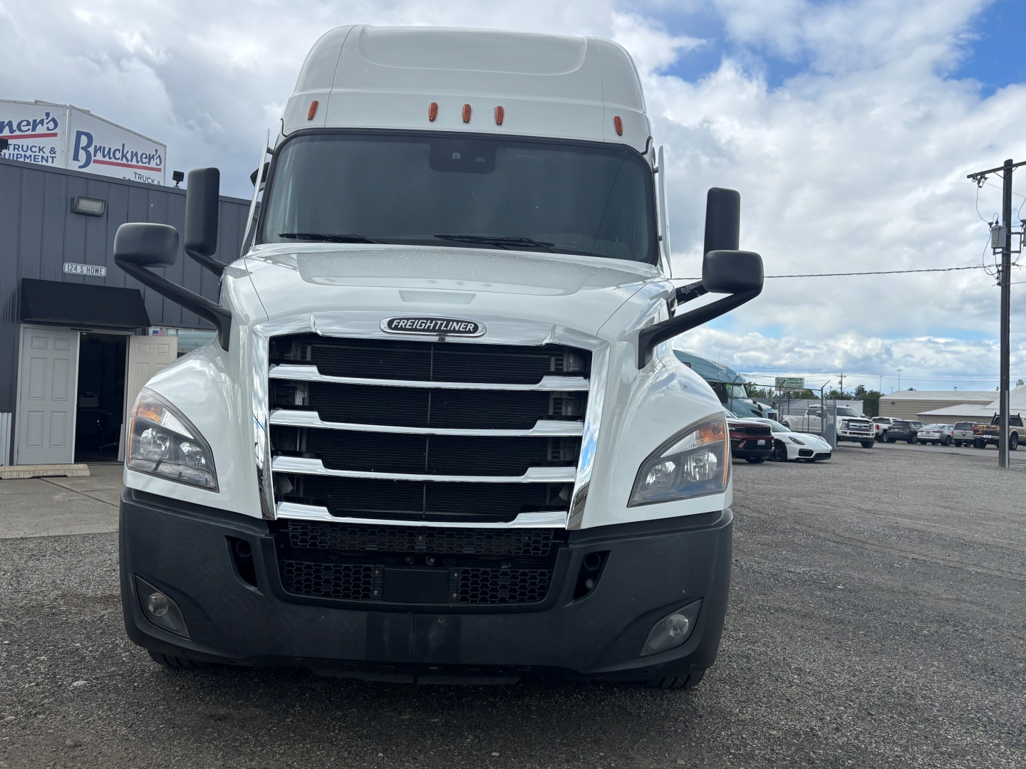 Freightliner CA-126 conventional sleeper truck front view showing chrome grille, bumper, headlights, and tall cab.