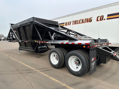 Trailer showing bottom-dump frame with dual rear axles and hydraulic components, CPS air ride light weight bottom dump.