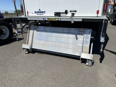 MD6 truck rear with incline ramp and aluminum utility box, platform and caster wheels visible.