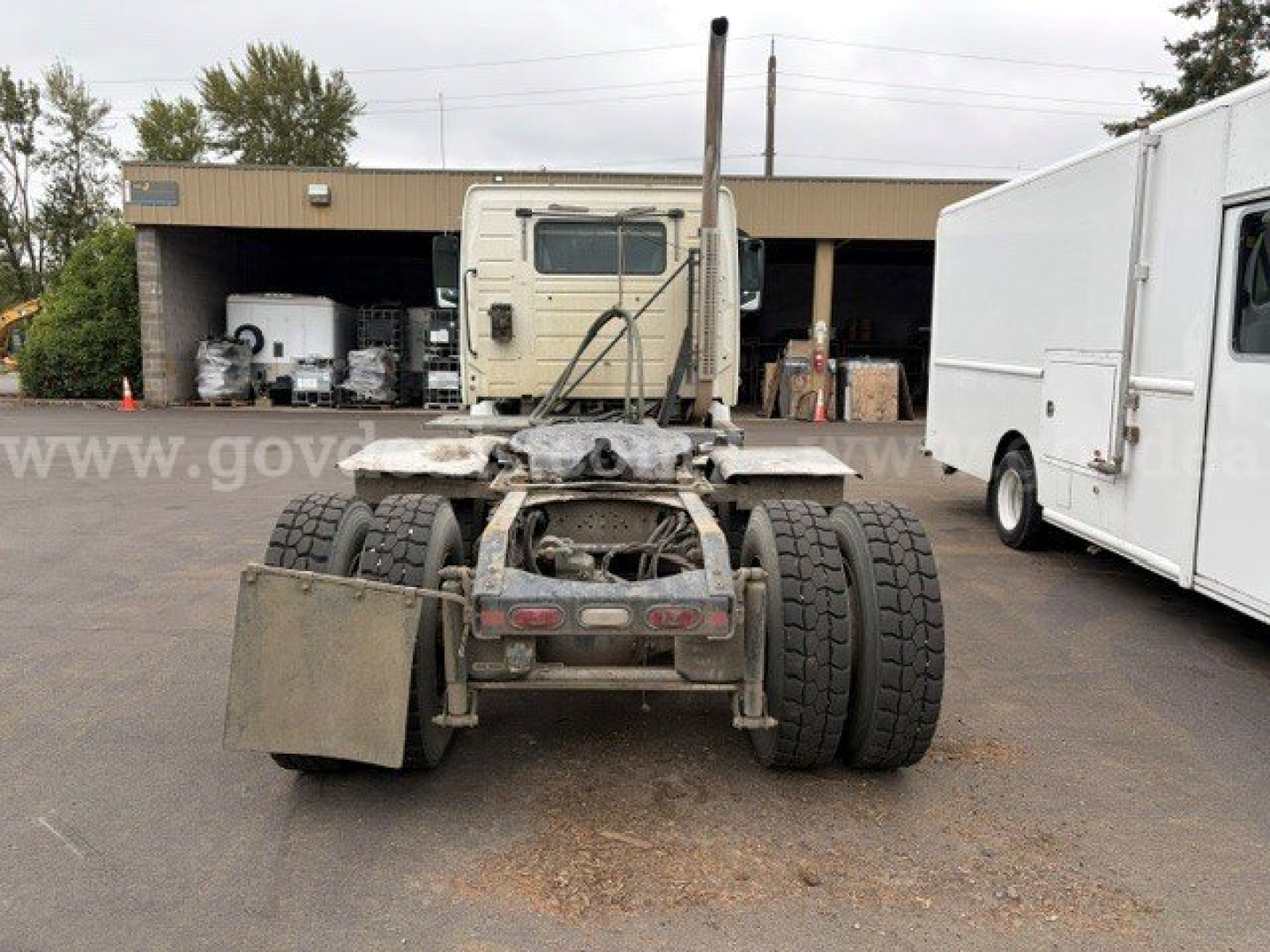 Volvo VHD truck chassis rear view showing fifth wheel and dual rear axles with heavy-duty tires.