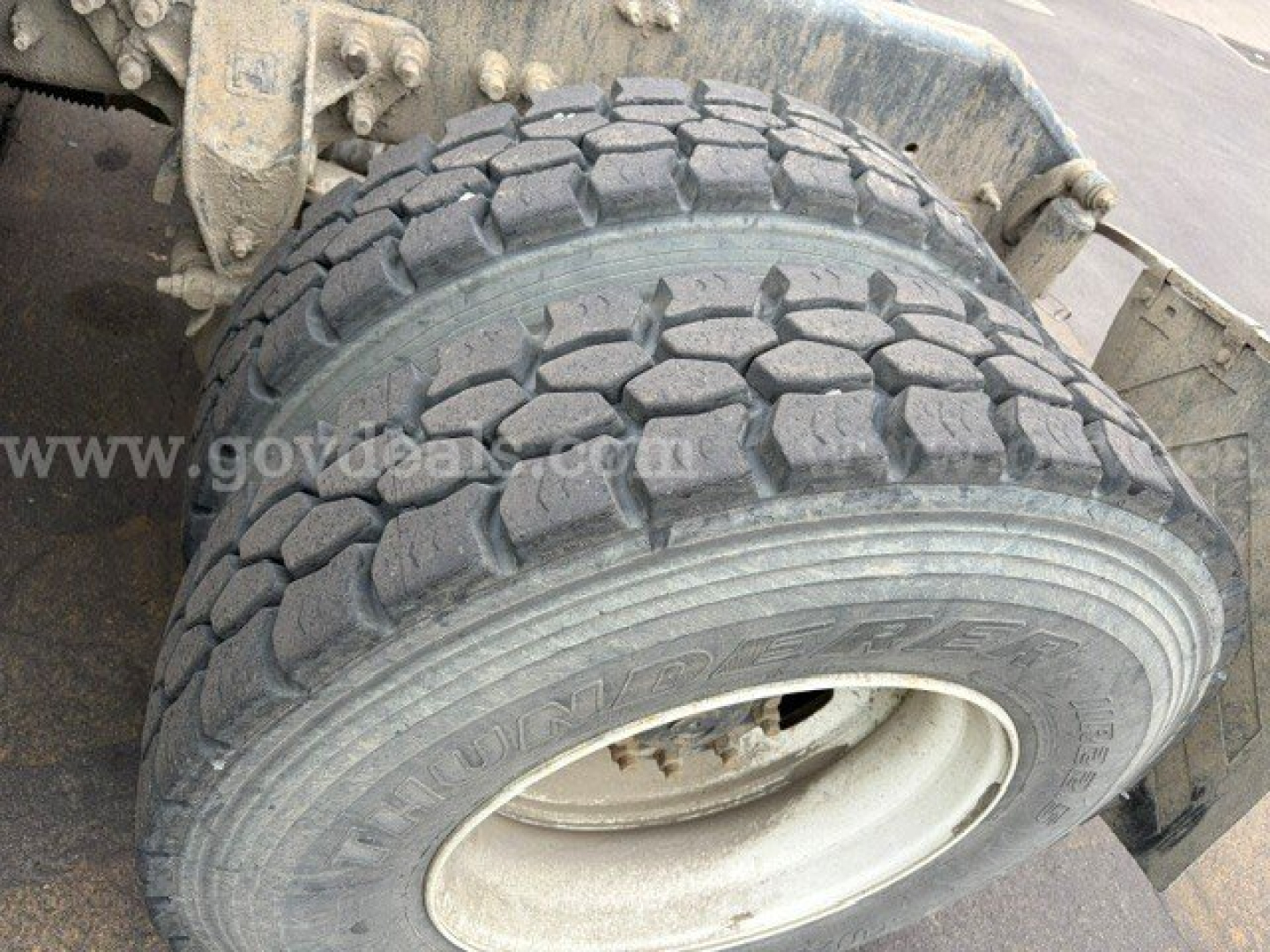 Wheel and tire assembly of a Volvo VHD truck showing dual rear wheel with tread pattern and rim; faint watermark text on image reads www.govdeals.org