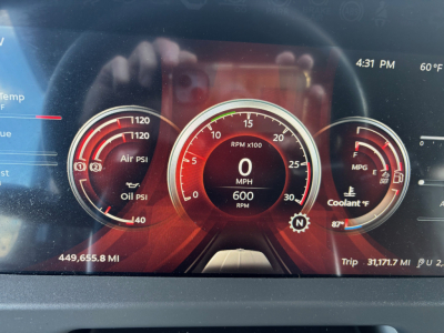 Peterbilt dash cluster showing RPM gauge, speedometer at 0, fuel, oil, air pressures; odometer 449,655.8 miles; trip 31,171.7 miles; 4:31 PM and 60F outside.