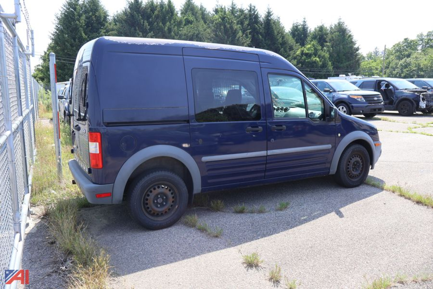 Ford Transit Connect cargo van side view, blue, passenger side with rear sliding door, 2011 model year label.