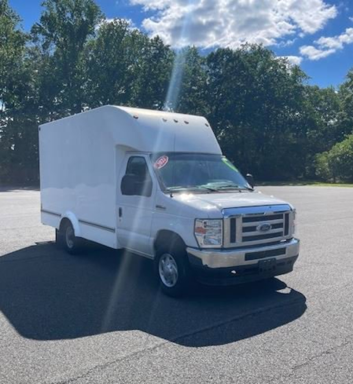 Ford E-Series Cutaway box truck in service showing cargo box on a stepped cab with Ford emblem grille and white paint.