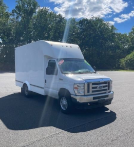 Ford E-Series Cutaway box truck in service showing cargo box on a stepped cab with Ford emblem grille and white paint.