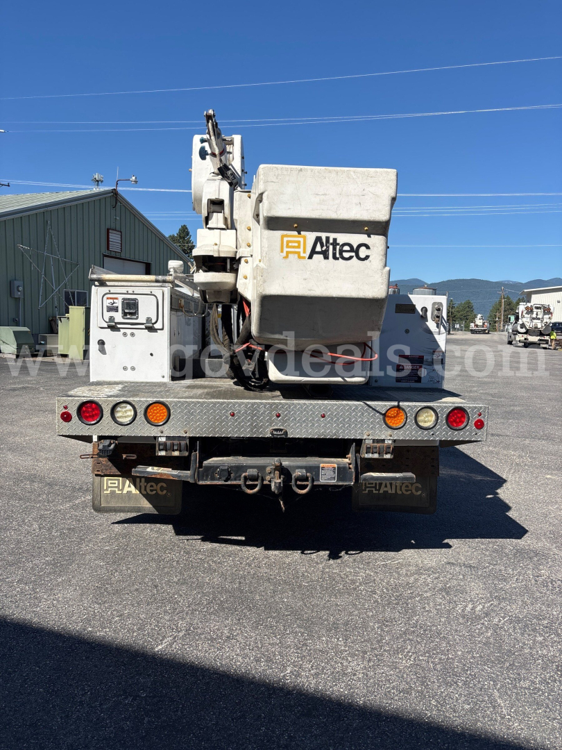 Altec bucket truck mounted on Dodge Ram 5500 rear view showing bucket and equipment with logo Altec.