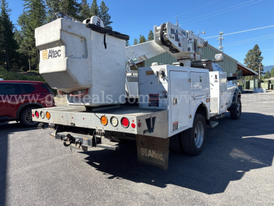 Altec bucket truck on service bed rear view showing bucket and crane with ladder racks