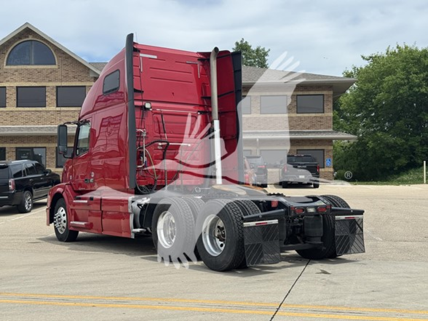Volvo VNL 64T670 sleeper tractor rear three-quarter view showing chassis and rear wheels.