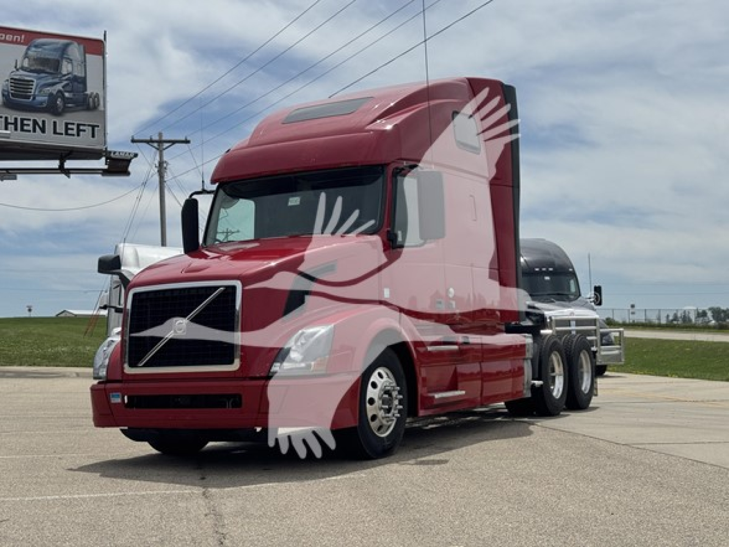 Volvo VNL64T670 sleeper truck in red, side view, with multiple axles and long hood.