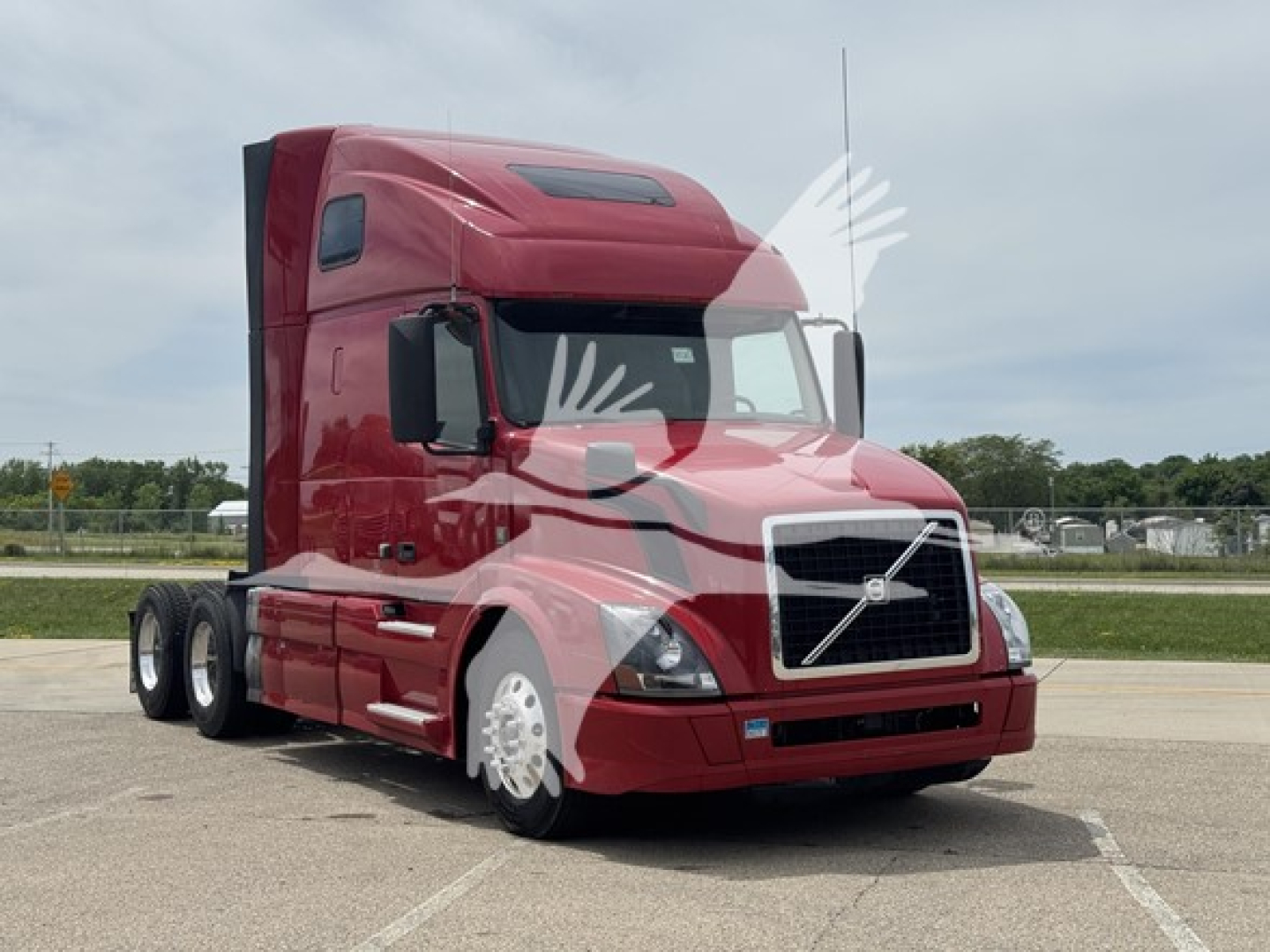 Volvo VNL64T670 truck in red paint base view showing sleeper cab and front grille.