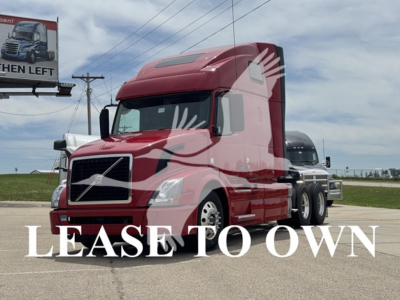 Volvo VNL64T670 tractor-trailer in red, front-right view with 'LEASE TO OWN' overlay text.