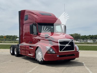 Volvo VNL64T670 truck in red paint base view showing sleeper cab and front grille.