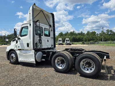 Truck chassis with cab on Freightliner Cascadia 126 indicating a daycab configuration and dual rear axles.