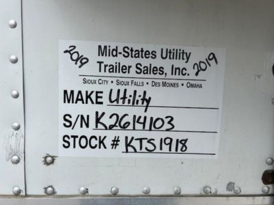 Mid-States Utility Trailer Sales, Inc. label on trailer door showing S/N K2614103 and STOCK # KTS1918 with handwritten year 2019.