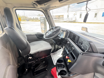 Cab interior of 2018 International LT daycab showing steering wheel, dash, and driver's seat.
