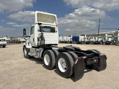 2018 International LT daycab tractor showing rear view with dual rear axles and mudflaps.