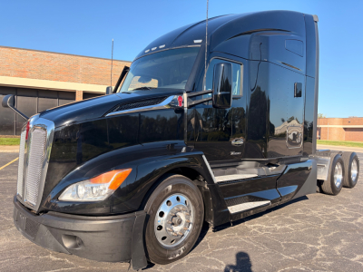 Kenworth T680 truck in black with sleeper cab, front grille and wheel details visible; no legible manufacturer text visible in image.