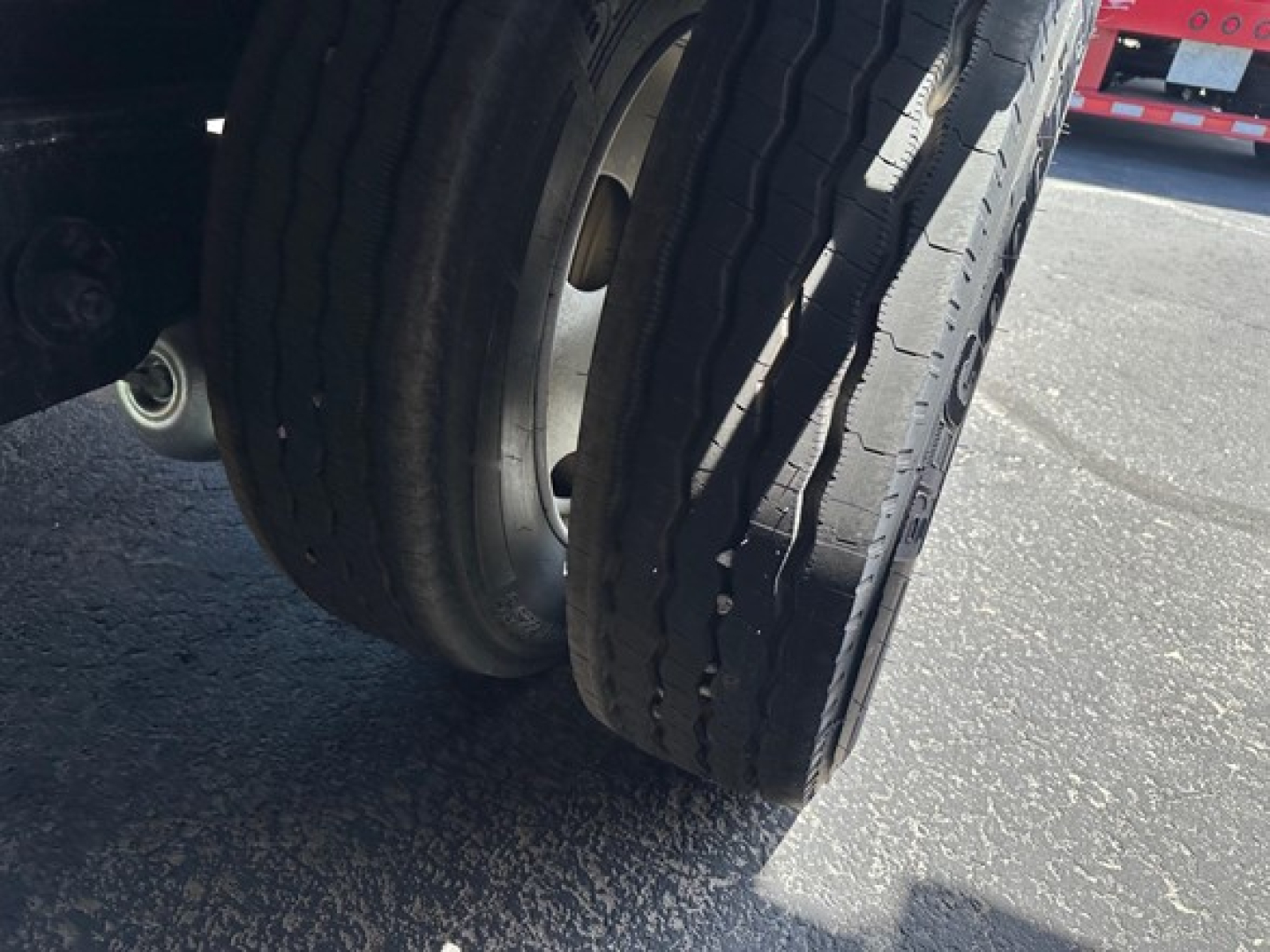 Dual rear trailer tires with tread, part of a Utility 4000Ae Combo Drop Deck trailer.