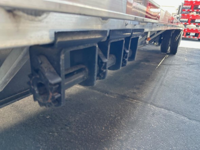 Under side of a Utility 4000Ae combo drop deck trailer showing lower understructure and hitching brackets.