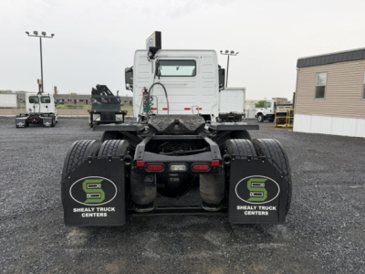 Rear view of a 2016 Volvo VNL64T300 tractor showing dual rear axles with mudflaps reading 'S' logo and 'SHEALY TRUCK CENTERS'