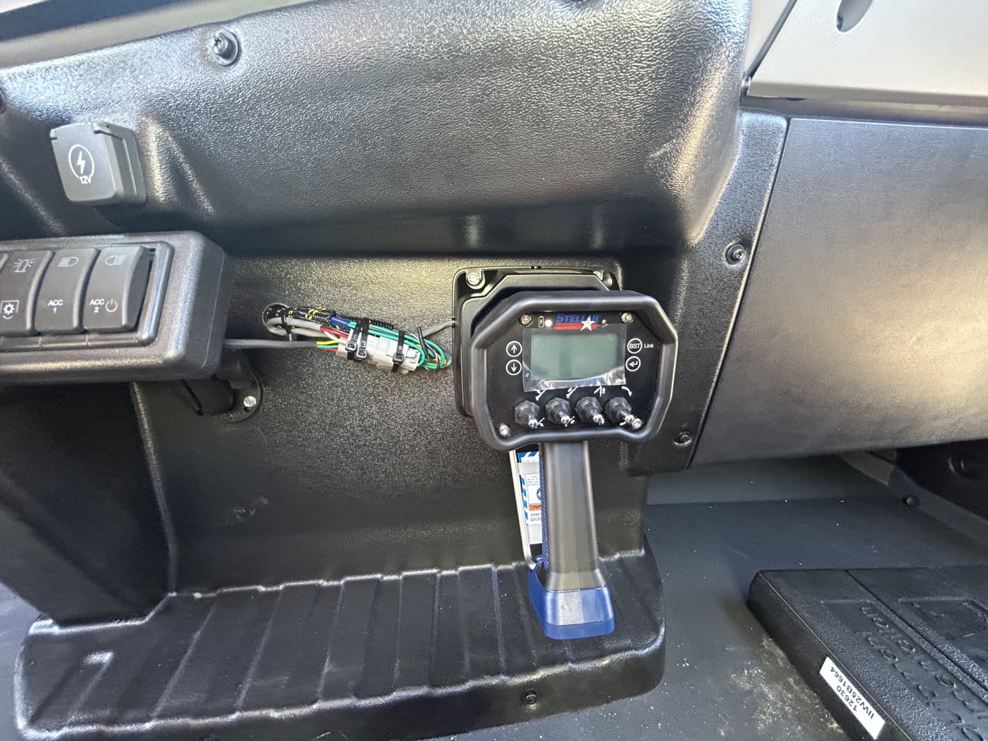 MD7 dash area showing digital control panel and wiring harness near steering column.