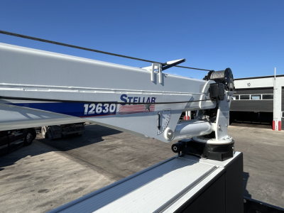 Truck boom arm with Stellar label and model 12630, hydraulic hose attachment visible.