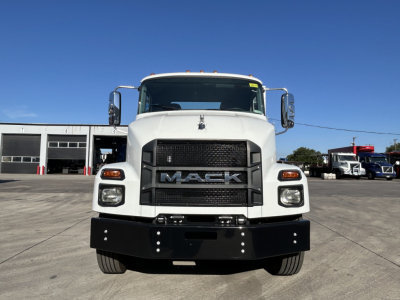 Mack MD7 front view showing grille with MACK lettering, large bumper, and white cab.