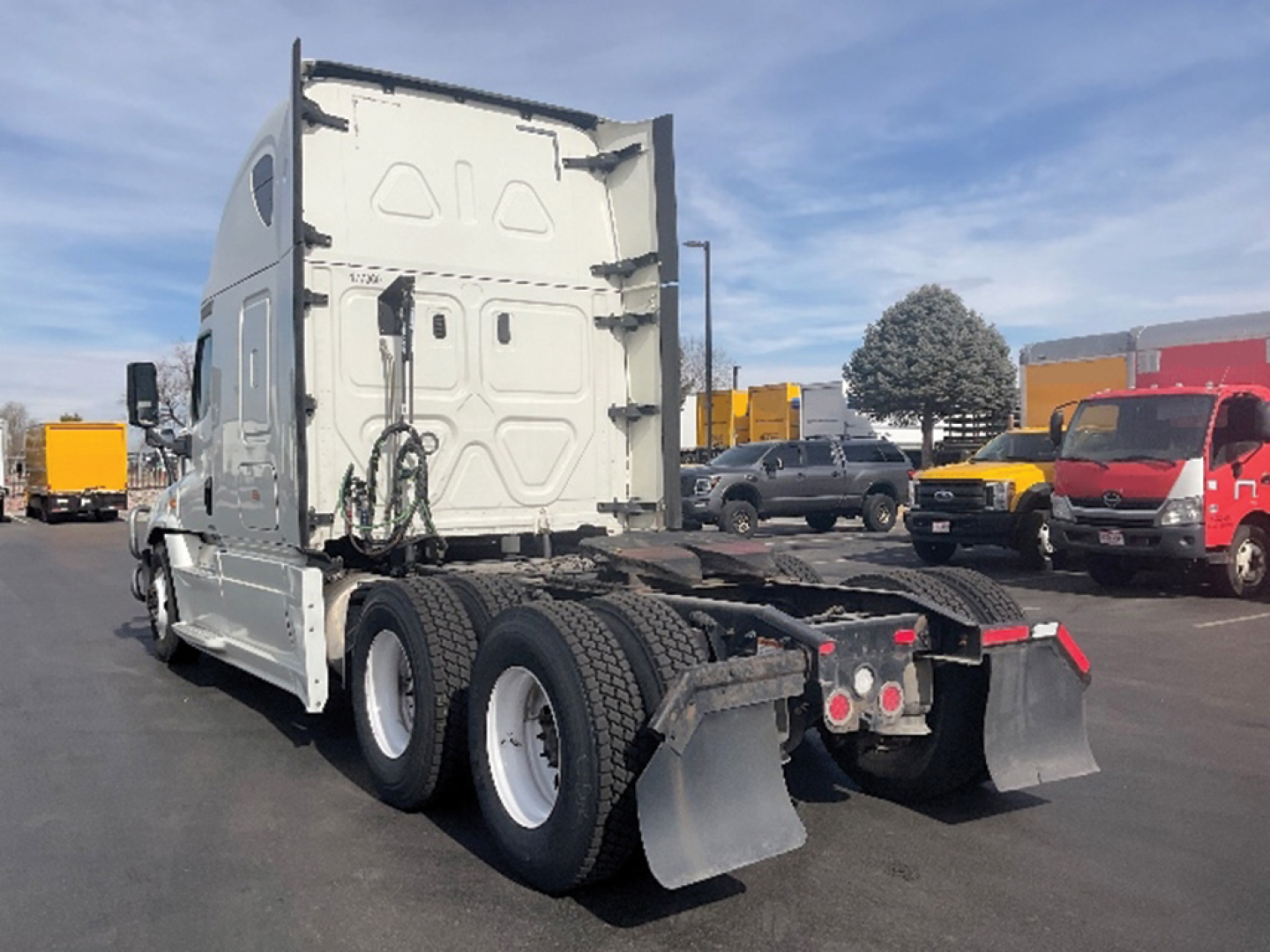 Freightliner Cascadia125 Evolution rear view showing six wheels, sleepers, and trailer kingpin area.