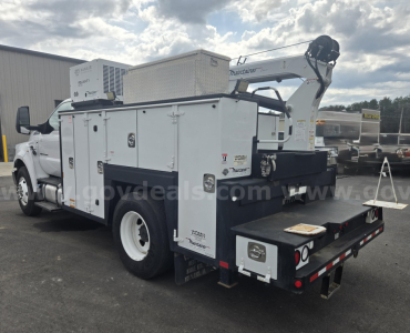 2017 Ford F-750 service/utility truck with a mounted utility crane; side compartments and a rear bed. Visible text includes 'Ford', 'F-750', and utility equipment labels on the service body.