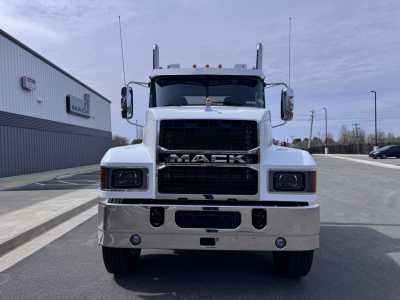 Mack PI64T conventional daycab front view showing large grille and bumper with Mack emblem.