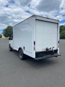 Ford Econoline commercial box truck rear view showing closed cargo area and bumper hitch