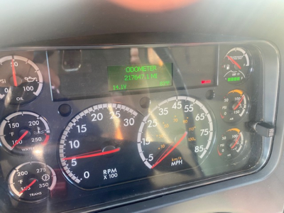 Dashboard view of 2019 Freightliner M2 106 showing ODOMETER 217647.1 MI and digital readout 14.1V; multiple gauges including RPM, speedometer, and engine indicators.