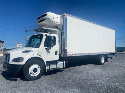 Freightliner M2 106 refrigerated truck with a white box and a topping unit, side view showing cab and cargo area.