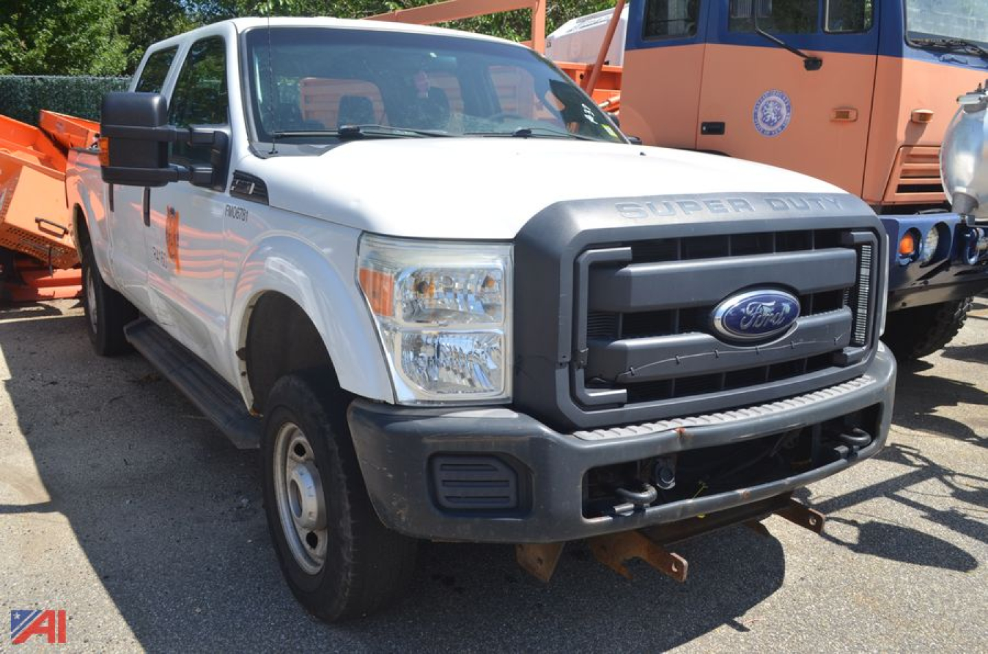 Ford F-250 Super Duty pickup truck 2012 white front view showing chrome grille, large bumper, dual headlights, and side mirrors.