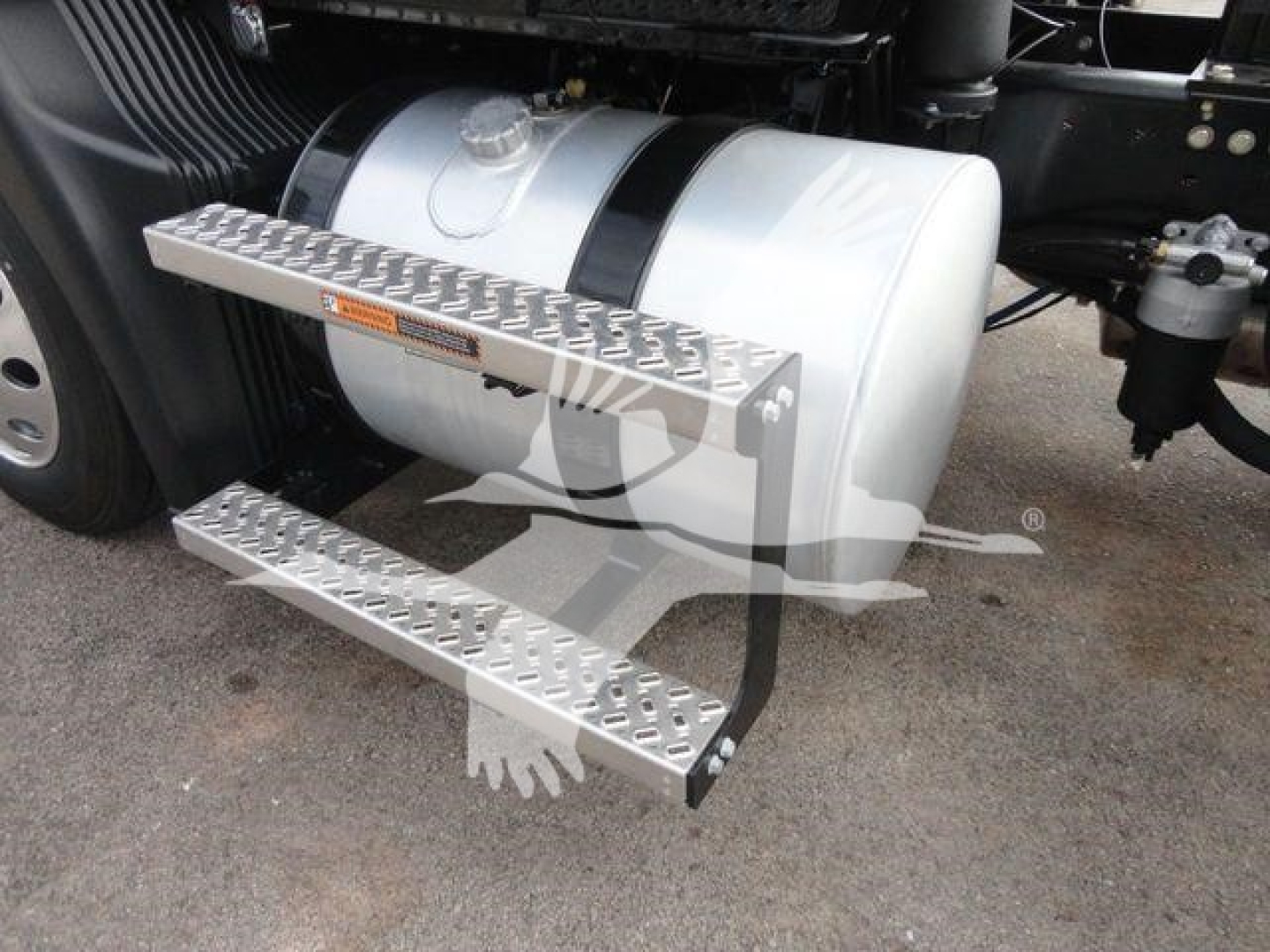 Trucks showing side-mounted fuel tank and aluminum steps on a Mack MD6 truck.