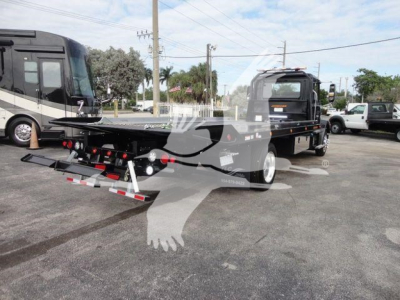 MD6 rollback truck with a low-bed and ramp system, front cab visible, manufacturer branding obscured by watermark.