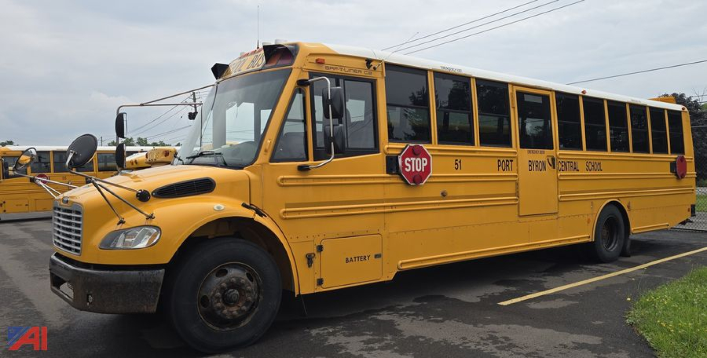 Yellow Freightliner Thomas Saf-T-Liner C2 school bus with stop sign and large front grille; visible text includes STOP sign, '51' door, 'PORT', 'B21', and other route markings along side.