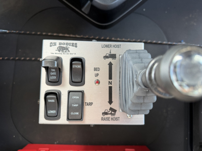Control panel labeled 'DS BODIES' with switches for tail gate lock, strobe, raise/lower, and a diagram showing lower hoist, bed up, winch, and raise hoist.