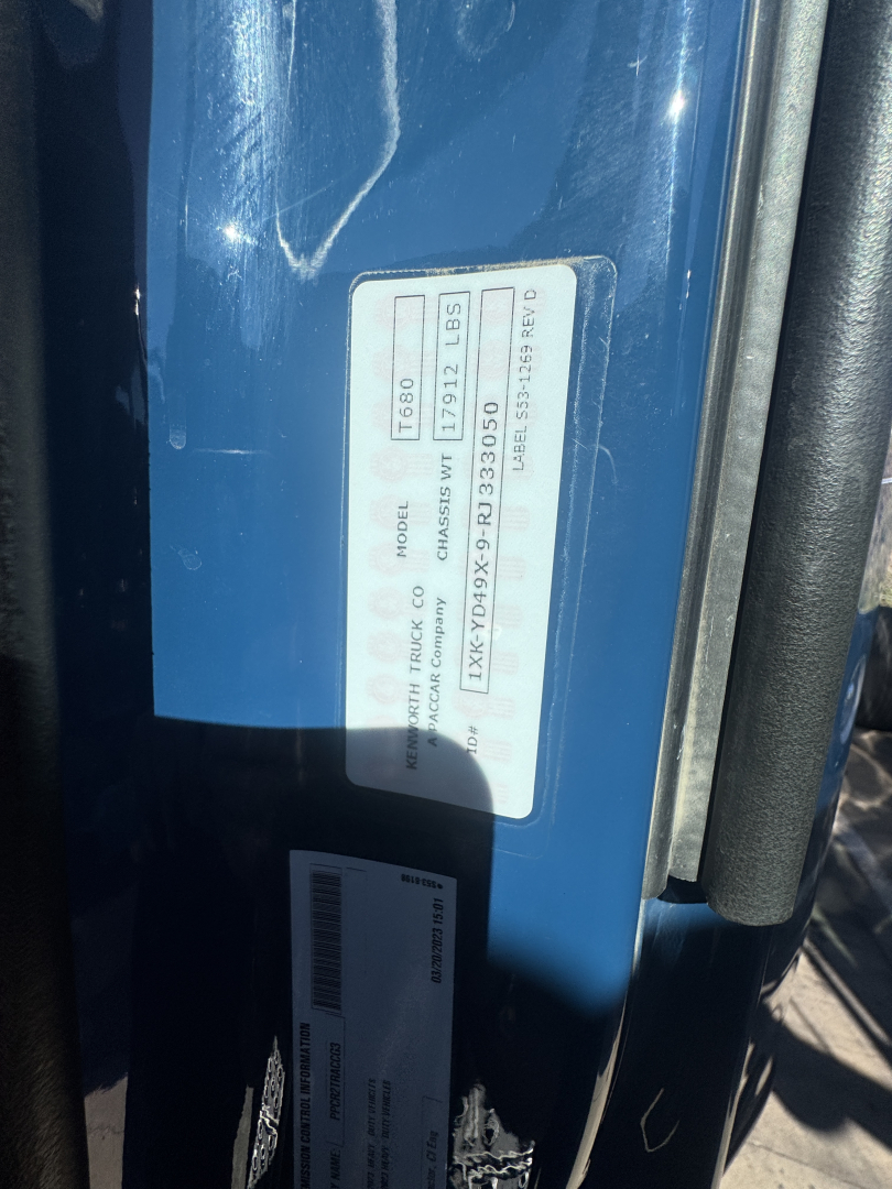 Kennworth T680 truck door jamb label with model and VIN info visible
