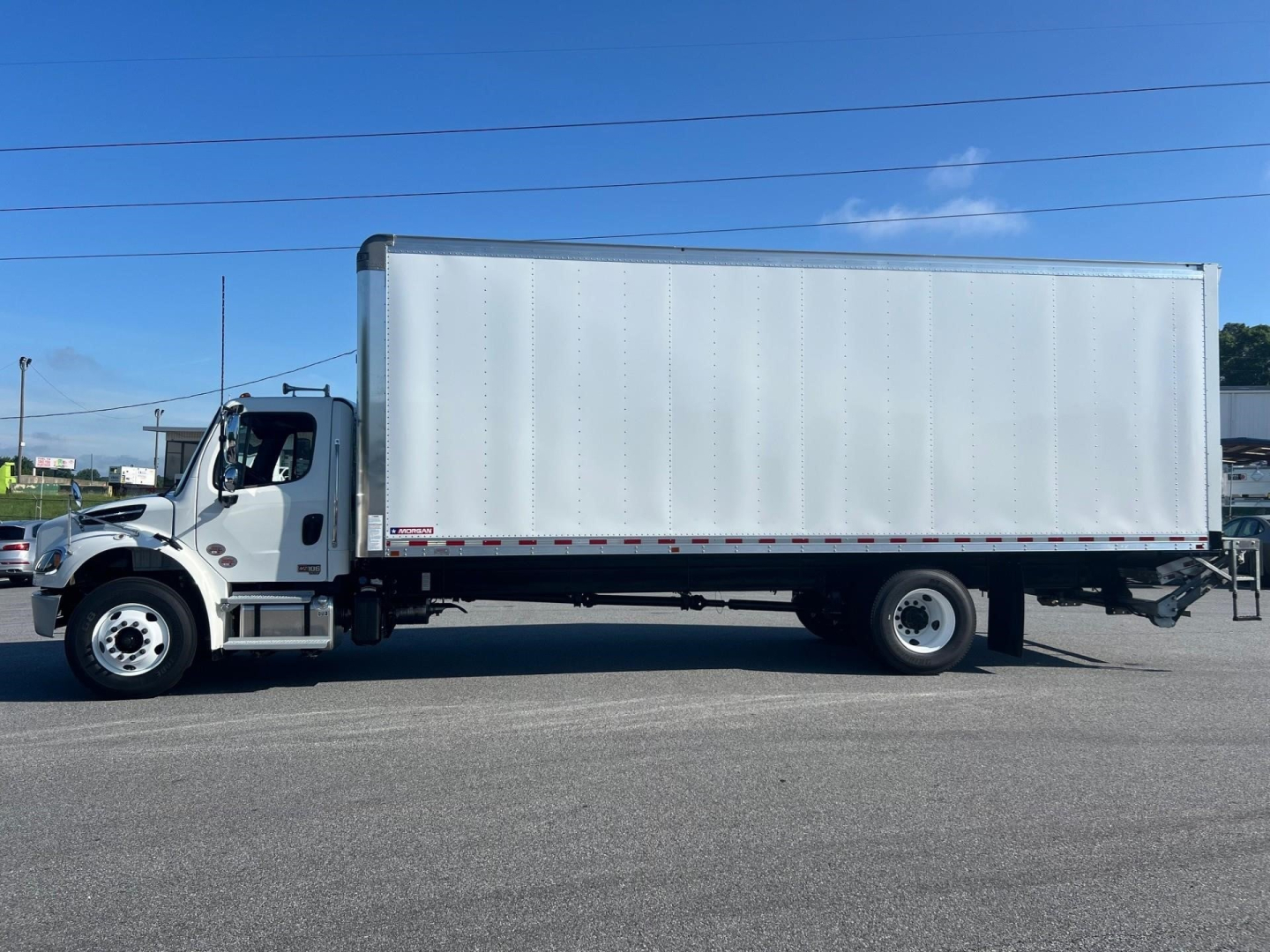 Freightliner Business Class M2 106 Plus box truck side view with cargo box, cab in front, VIN/stock not visible on image.