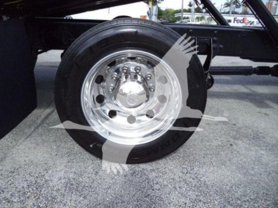 Wheel and hub area of a 2019 International Durastar 4300 rollback truck showing shiny chrome rim and tire.