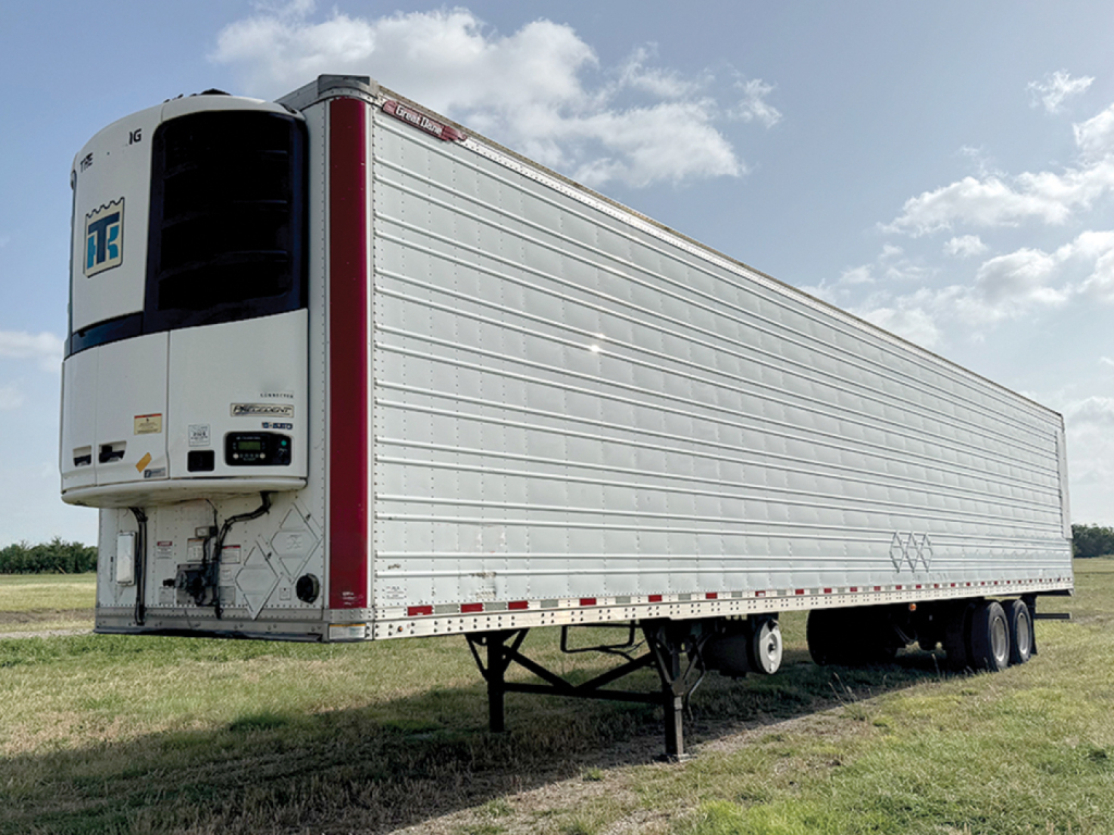 Great Dane Everest SS refrigerated trailer in side view showing front refrigeration unit with branding and landing gear.