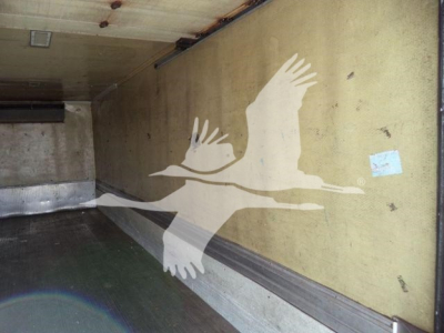 Truck trailer interior side wall with a graphic of three flying geese. No legible labels or numeric text visible.