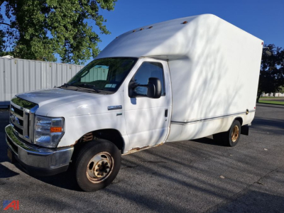 Ford E-350 box truck side view showing cargo box and cab, front grille, headlights, and wheel tires.