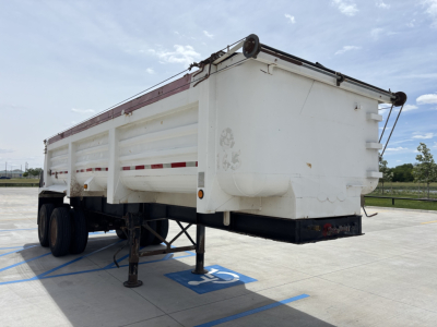 Dump trailer (S-96) from rear-left perspective, white metal bed with side rails and supports, raised landing gear, empty hitch area.