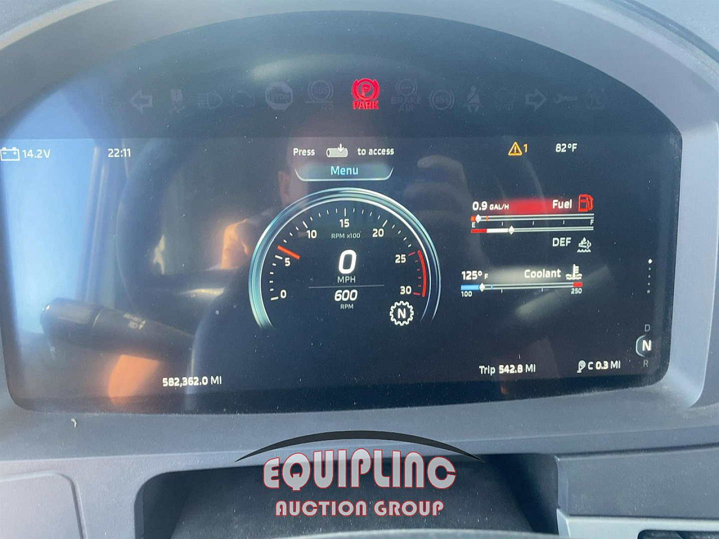 Kenworth T680 dashboard cluster displaying speedometer, fuel, DEF, coolant gauges; digital readouts show 0 MPH, 582,362.0 mi, trip 542.8 mi; VIN and stock number not visible on dash.
