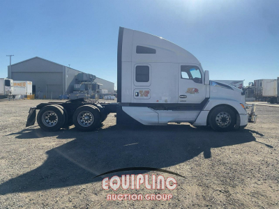 Kenworth T680 side view tractor with sleeper cab, white color, sixth wheel, with Equipping Group branding on ground in front. Visible text includes equipment markings on cab sides and fuel/air inlets.