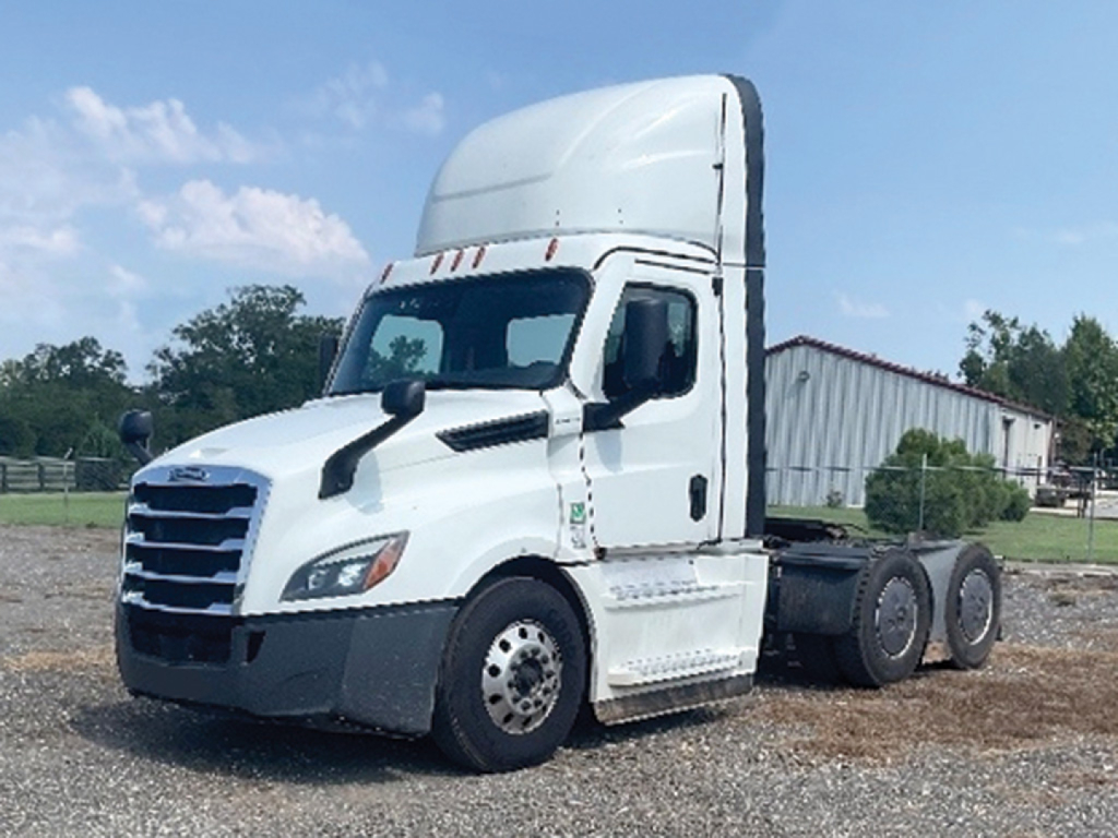Truck image: 2023 Freightliner Cascadia126 daycab tractor with white cab, elevated sleeper/roof fairing, three axles rear, visible fuel tanks and wheels.