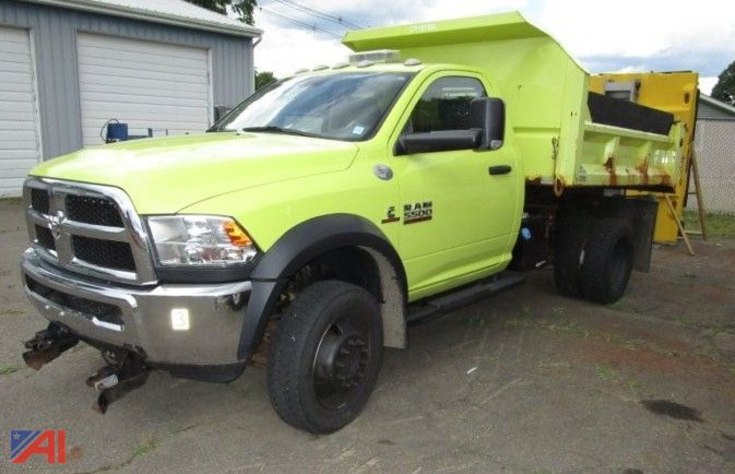 2016 Ram 5500 dump truck with a lime green plow/dump bed. Front grille shows RAM emblem, dual front wheels, black fender flares, and a chrome bumper. Visible text on door: RAM 5500, 6.7?!, and utility truck markings.