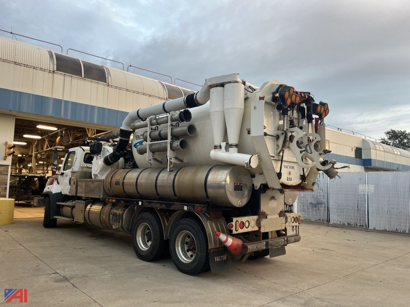 Freightliner 108 SD Vactor truck rear with vacuum tank and hoses visible